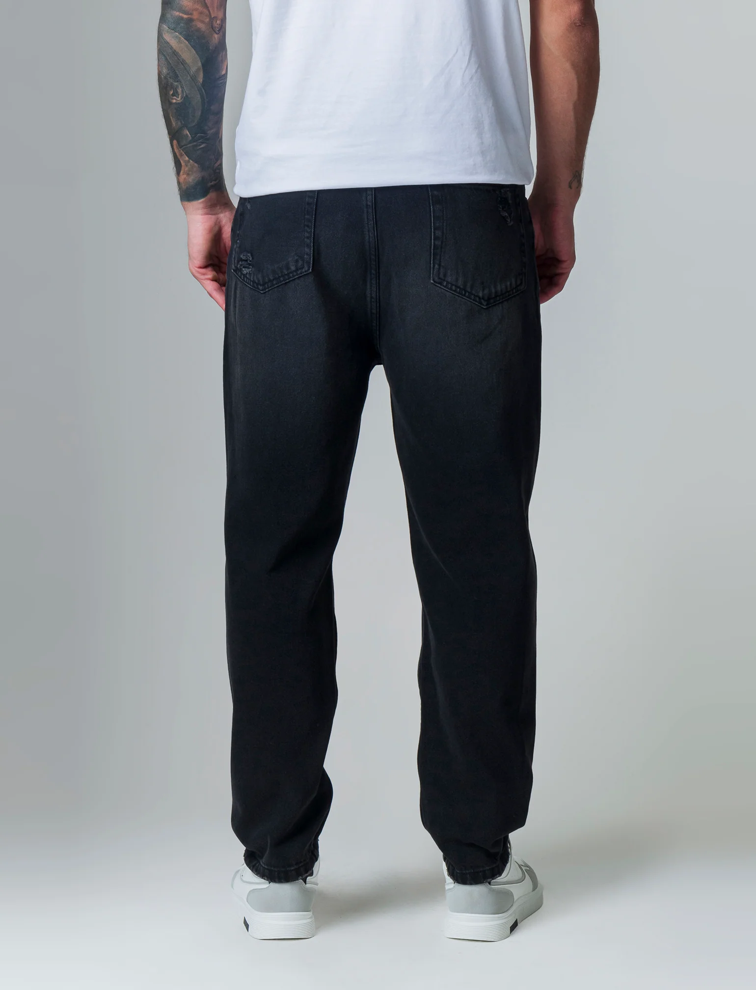 Jeans nero loose fit con strappi da uomo - Nero